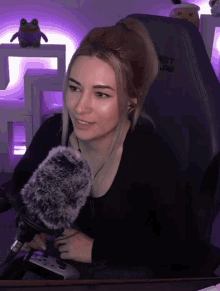 a woman is sitting in a chair with the word net on the back