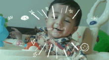 a baby sitting in a high chair with arabic writing on it