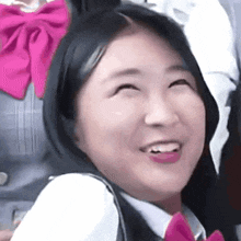 a close up of a woman making a funny face with her mouth open .