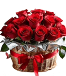 a basket filled with red roses and a red bow
