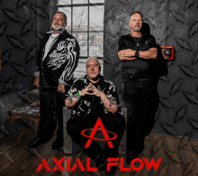 a group of men are posing for a picture with the word axial flow in red