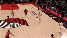 a basketball game is being played on a court that says moda center