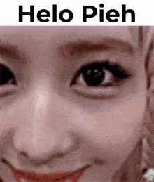 a close up of a woman 's face with the words " helo pieh " above it