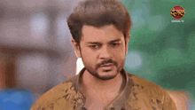a man pointing at the camera with a dangal tv logo in the corner