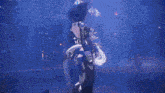 a close up of a person 's torso with a blue background