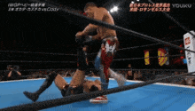 a wrestling match between cody and iwgp in a ring
