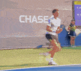 a blurry picture of a tennis player with the word aseo in the back