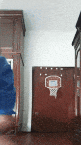 a basketball hoop is hanging on a wall in a room