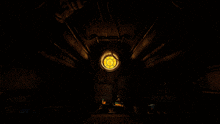 a dark room with a circular window and a few pipes