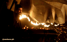 a ramcharan gif with a man standing in the dark