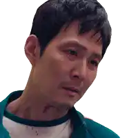 a close up of a man 's face with a white shirt and a green jacket