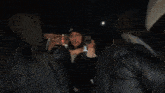 a blurry picture of a person 's face with a hood on