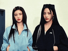 a couple of girls standing next to each other with one wearing a jacket that says idol on it