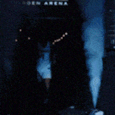 a basketball player is walking through a tunnel that says garden arena on it