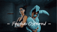 a man in a bunny costume stands next to a woman in a black dress and the words frohe ostern