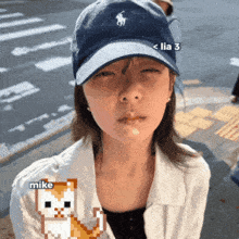a woman wearing a blue hat with a pony on it has a pixelated cat next to her with the name mike on it