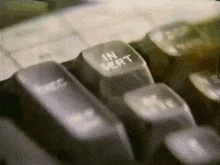 a close up of a keyboard with a key that says " in heart "