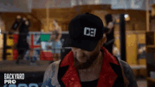 a man wearing a hat that says 031 looks down