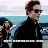 a man wearing sunglasses and a black jacket with the words gemma on her way to select lectus