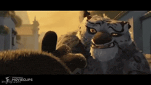 a close up of a cartoon tiger with the words movieclips on the bottom right