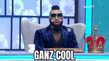 a man with a beard and sunglasses is sitting in a chair with a crown on it .