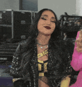 a woman in a wrestling outfit stands in front of a aran keyboard