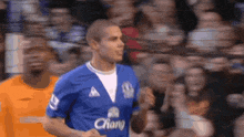 a soccer player wearing a blue jersey that says chang on it
