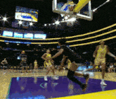 a female basketball player with the number 23 on her jersey is jumping for the ball