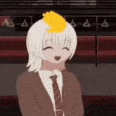 a girl with white hair and a yellow hand on her head is smiling .