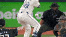 a baseball player with the number 8 on his jersey throws a ball