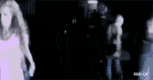 a blurry picture of a woman in a purple dress with the words rbd.gif at the bottom