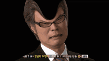 a man wearing glasses and a suit has sbs written on the bottom of the screen