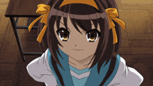 a girl with brown hair and yellow bows on her hair