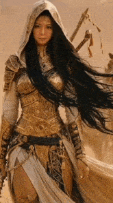 a woman with long black hair is wearing a hooded robe and holding a sword .