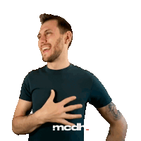 a man wearing a black shirt that says mcdh