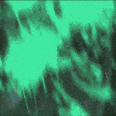 a green and black background with a glowing light coming out of it .
