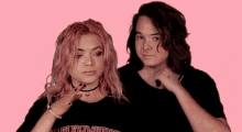a girl with pink hair is wearing a black harley davidson shirt