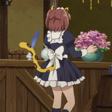 a maid with a leopard tail is standing in front of a vase of flowers