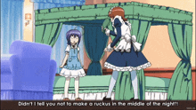 a girl in a maid outfit is standing in front of a bed