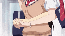 a girl with a heart shaped bracelet on her wrist holds another girl 's arm
