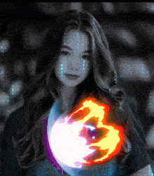 a woman is holding a firefox logo in her hand