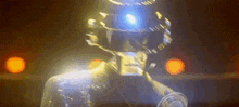 a close up of a person wearing a helmet with a light on it