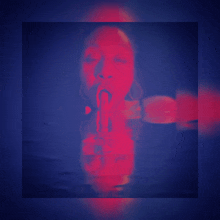 a blurry picture of a woman with her mouth open and a red background