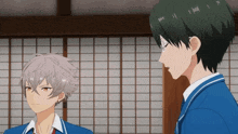 a couple of anime characters standing next to each other in a room