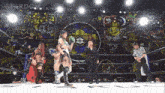 a wrestling match is being held in front of a stained glass wall