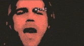 a close up of a man 's face with the word hi-fi on his eyes .
