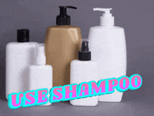 a group of plastic bottles with the words use shampoo written on them