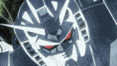 a close up of a robot with a red eye and a white head