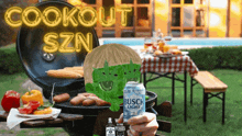 a person holding a can of busch light next to a grill