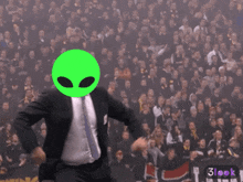 a man in a suit and tie has a green alien head on his face